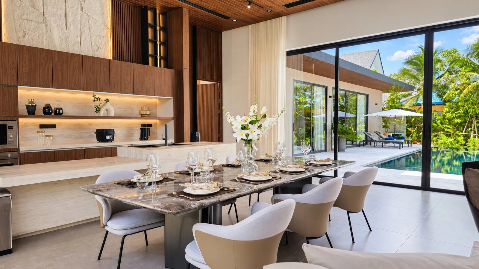 Dining table beside the kitchen and the pool terrace at Sea Central Villa, Phuket