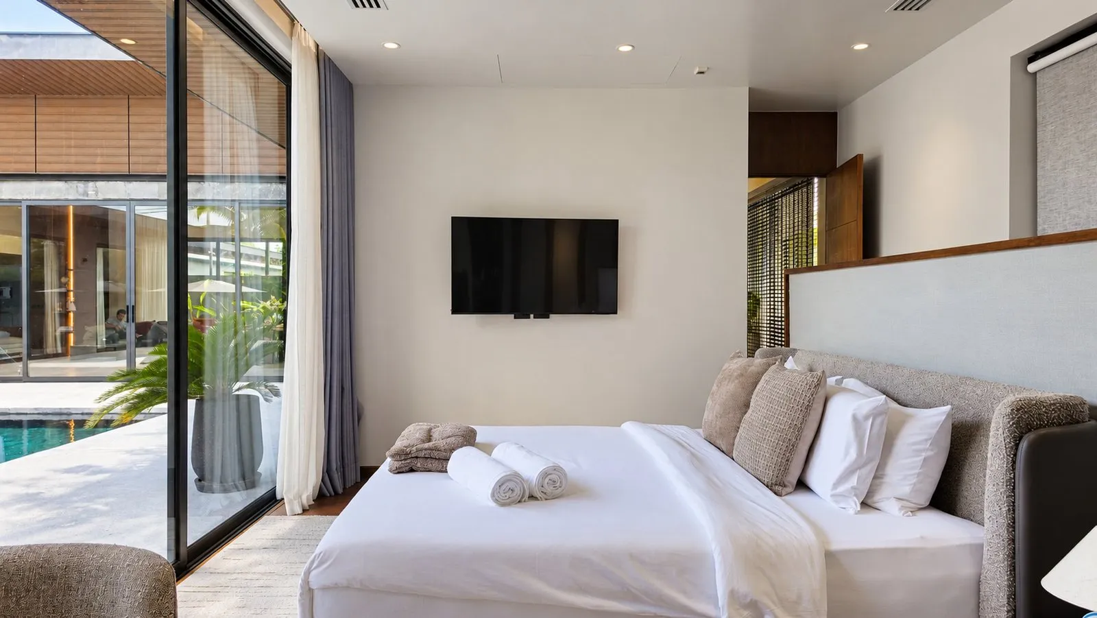 Bedroom opening to the pool at Sea Central Villa, Phuket