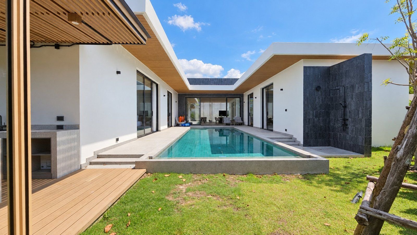 Pool and garden between the villa wings at Star Silas Villa, Phuket
