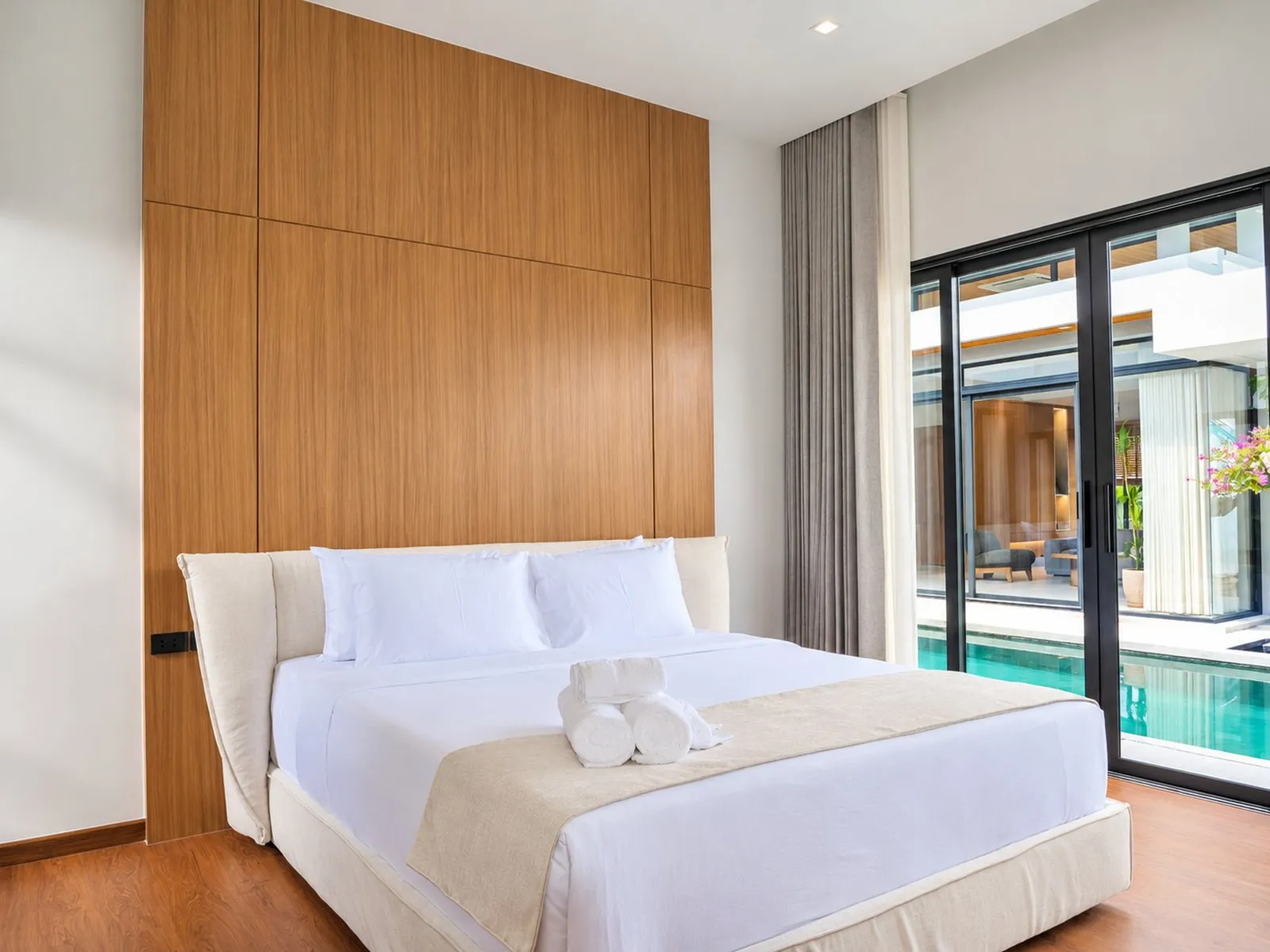 Bedroom with sliding doors to the pool at To’Summer Villa, Phuket