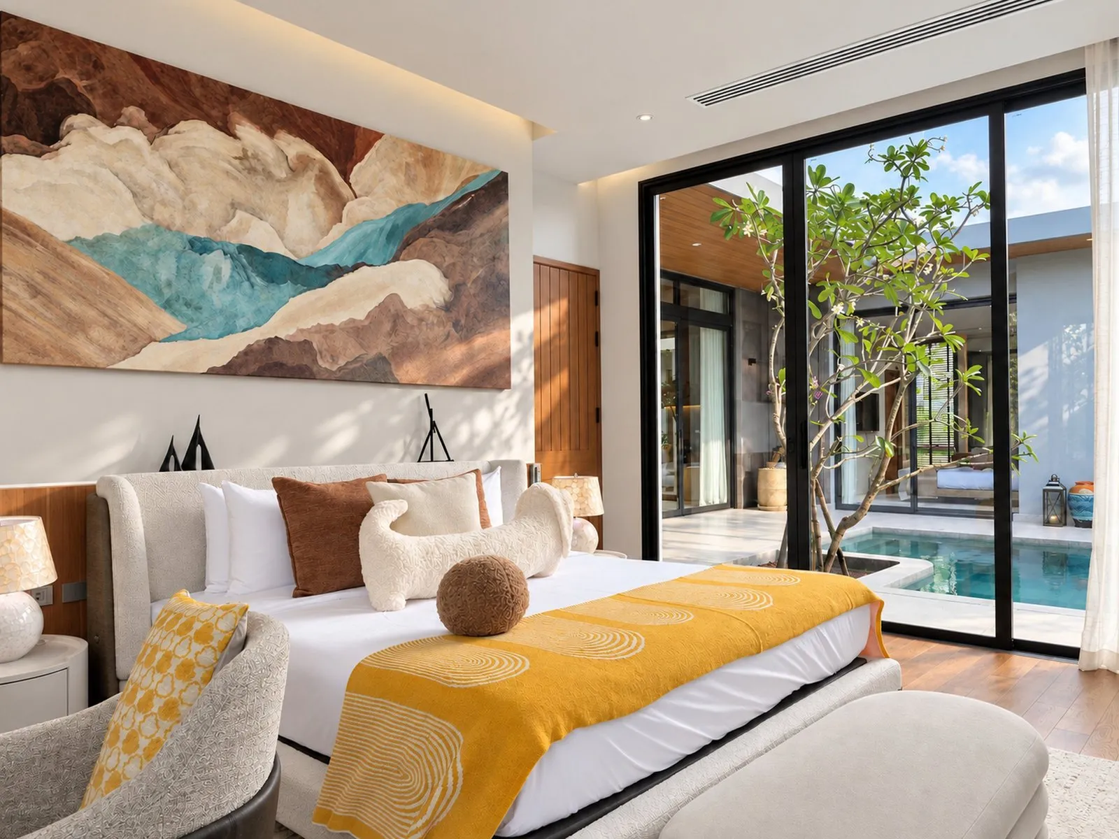 Bedroom with glass doors opening to the courtyard pool at Villa Oliver, Phuket